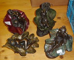 Four Heredities bronzed figures of naked ladies reclining in leaves