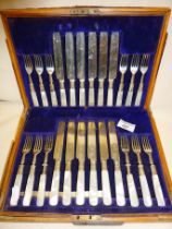 Edwardian set of 24 silver dessert knives and forks with mother of pearl handles and finely engraved