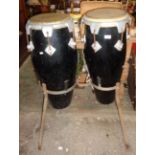 Two bongo drums on stand