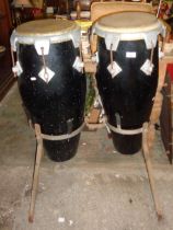 Two bongo drums on stand
