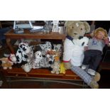 Large teddy bear, a Rico doll and a collection of soft tow, inc. giraffes, cows, bears and dogs