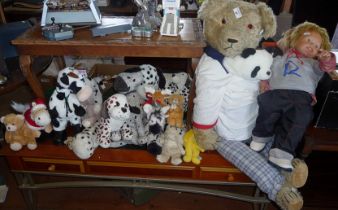 Large teddy bear, a Rico doll and a collection of soft tow, inc. giraffes, cows, bears and dogs