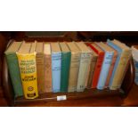 Bookrack with books, mostly John Buchan hardbacks