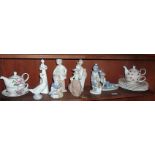 Collection of assorted Lladro type figurines and teapots