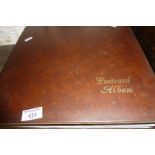 Large postcard album containing vintage geographical colour postcards