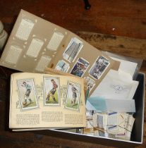Box of loose cigarette cards, cigarette cards in albums and loose stamps