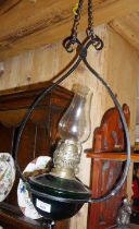 Edwardian Arts & Crafts wrought iron hanging oil lamp with green glass reservoir