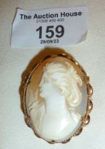 Shell cameo brooch in a 9ct gold frame, with pendant fitting, and approx. 4cm high, maker E.J.