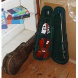 Modern violin (11") in case and an older violin case