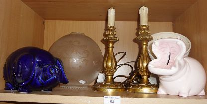 Pair of giltwood table lamps, a pottery hippo money box and similar pig and an etched glass oil