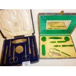 Two vintage manicure sets, one with hallmarked silver handles, the other Art Deco green plastic.