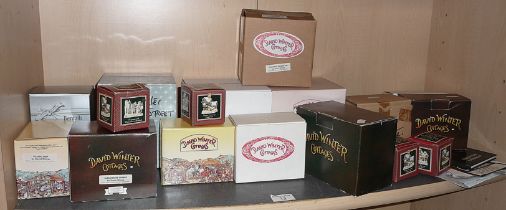 Collection of sixteen boxed David Winter cottages and ornaments