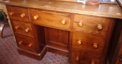 Victorian pine kneehole desk of 7 drawers flanking a cupboard and having a mahogany top 4' wide x 2'