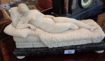 19th c. alabaster figure of a reclining Venus on a green marble base and alabaster bun feet, approx.