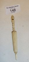 19th c. carved bone needle case in the form of an umbrella and containing a Stanhope view of