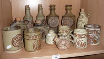 Collection of Tremar pottery bottles and mugs