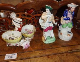 Meissen porcelain salt with two bowls flanking a putti figure (A/F), blue painted mark to base, with