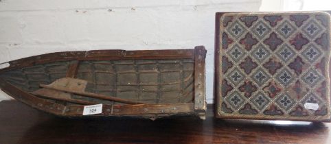 Old scratch-built model of a rowing boat having oilskin hull stretched over willow frame, 20"