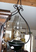 Edwardian Arts & Crafts wrought iron hanging oil lamp with green glass reservoir