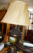 Urn shaped toleware table lamp with painted decoration of a racehorse with shade
