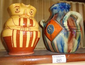A Susan Juniper glazed terracotta character jug and a Continental Art pottery 3 handled vase