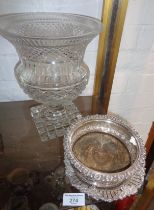 A silver plated wine coaster and dish, together with a Victorian cut glass champagne cooler on