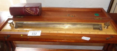 Cased brass and boxwood rolling ruler supplied by W.H. Harling of London and formerly belonging to