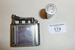 A silver plated Dunhill "The Vanity" 1928 petrol lighter with enclosed lipstick and powder case,