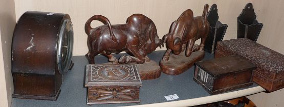 Pair of carved hardwood bramah bull bookends and boxes