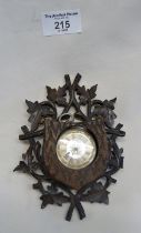Victorian silver pocket watch in a Black Forest carved holder