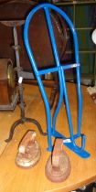 Painted iron saddle rack, blacksmith made spike candlestick and two flat irons