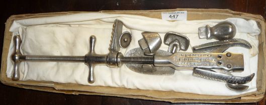A Magic Polish Co. Ltd. of Leicester shoe stretcher with bunion attachments, etc.