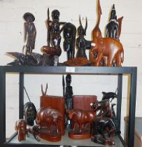 Large collection of African carved animals and figures including water buffalo bookends