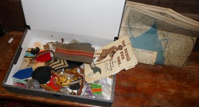 Good collection of military badges, buttons, ephemera, inc. 1945 map of Rangoon to Bangkok and an