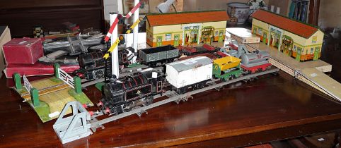 Hornby '0' gauge clockwork train set with two tank engines, rolling stock, two station platforms,