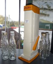 Retro Soda Stream machine with bottles