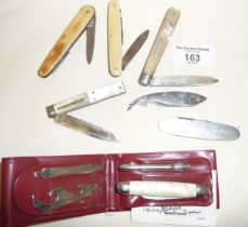 A silver bladed folding fruit knife and five others with a vintage "mini-kit" tool kit