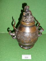 18th c. Chinese bronze two-handled censer having pierced cover with lion finial, 19cm tall