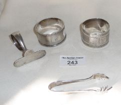 Hallmarked silver napkin rings, tongs and a silver baby pusher, approx. 99g