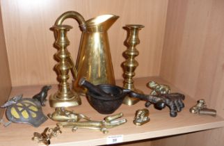 Pair of Victorian brass candlesticks, a water pitcher, other brassware, an iron boot jack, an iron