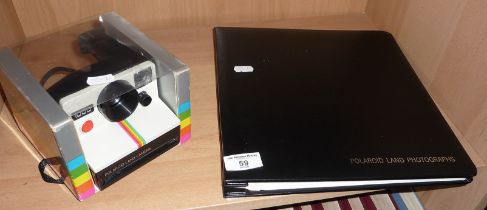 A Polaroid Land Camera 1000, and a Polaroid Land Camera photograph album