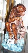 Continental majolica figure of a monkey with baby, 20cm high