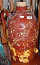 Large terracotta flagon with sgraffito foliate decoration