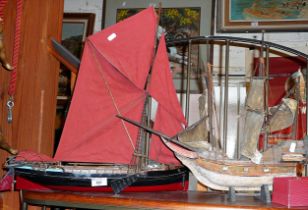 Scale model of a Thames Lugger sail boat and a wooden galleon