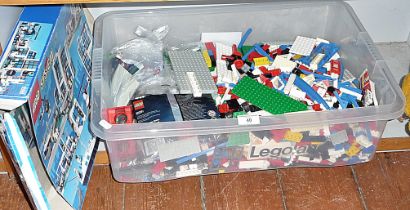 Crate of Lego pieces and boards