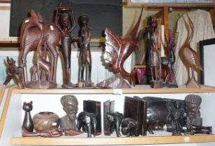 Large collection of African carved hardwood figures and animals, including elephant and rhino