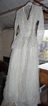 Vintage clothing:- a bridal gown (to suit Miss Haversham!), and a crochet-work bedspread