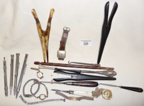 Four various antique propelling pencils, wrist watches, button hooks and glove stretchers