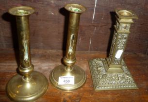 Pair of early 19th c. brass push-up candlesticks and classical relief brass candlestick