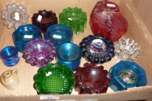 Collection of assorted coloured glass salts and candle holders